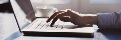 Image of man working with a laptop