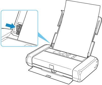 Figure: Paper guide slid across paper stack (shown in inset)