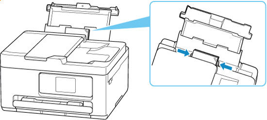 Slide the right paper guide to align both guides with the sides of the paper stack