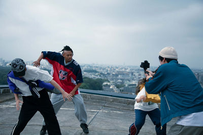 Person Recording People Dancing