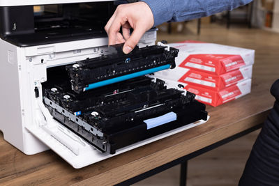 Person Removing a Toner