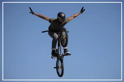 Biker Mid Air Doing a Pose