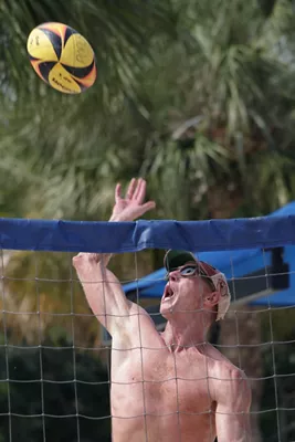 Volleyball Player Spiking a Ball