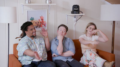 people on couch with PTZ camera behind them