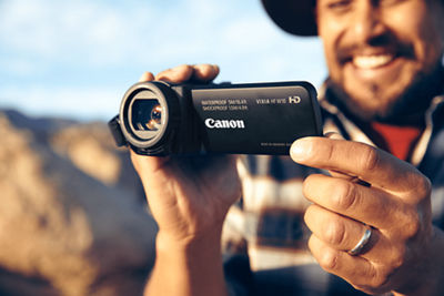 Individual holding a camcorder