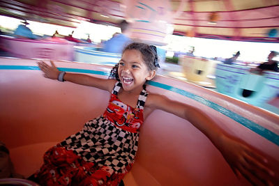 little girl on the Disney teacup ride
