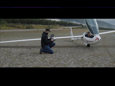 Person Using Canon Cinema Camera to Record Plane
