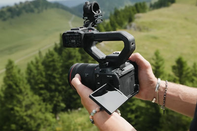 Person Holding the Canon EOS C50