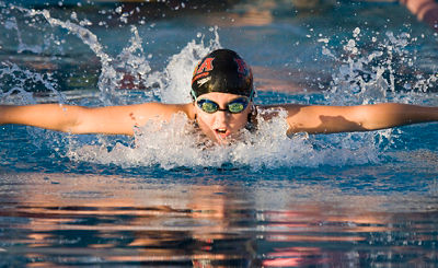 A swimmer doing breastroke, in the upward portion of the movement