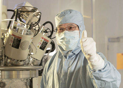 Person in hazmat suit working on FPA-5500iZa Stepper