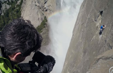 Person Using Canon Cinema Camera to Film a Rock Climber