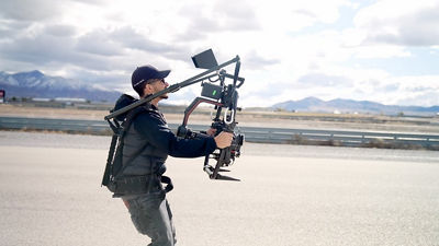 Man with a cinema camera on a gimble