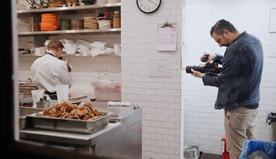 Cinematographer Recording Chef with a Canon Cinema Camera