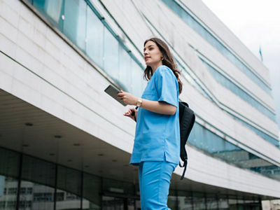 woman outside of a hospital