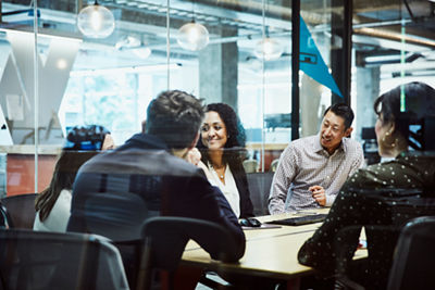Image of a group of people in a conference room