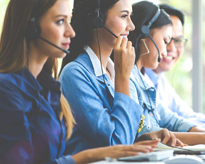 Girls working at customer help centre