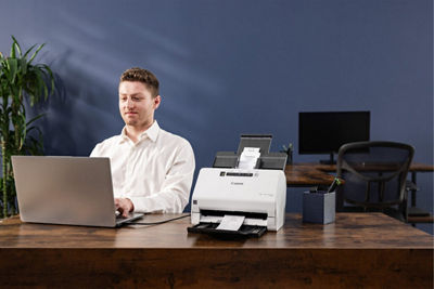 Person Scanning a Paper