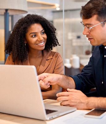 man and woman working in a data center