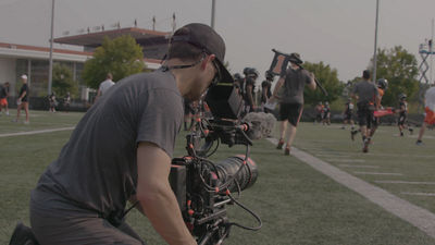 cameraman filming in a house of worship