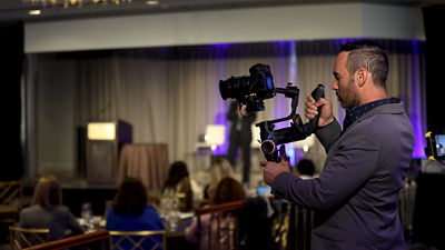 Man filming corporate event