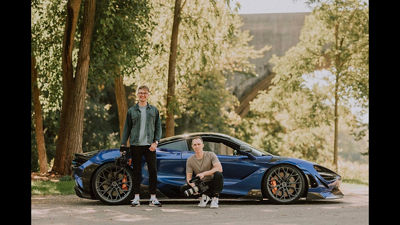 Two People in Front of a Car