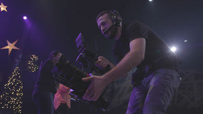 Man filming a Christmas event