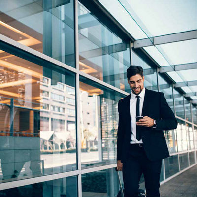 Image of a man looking at his phone