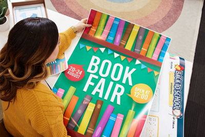 Person Holding Poster