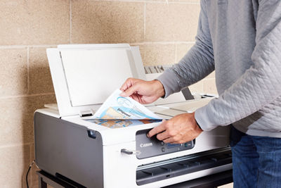 Person Scanning Paper