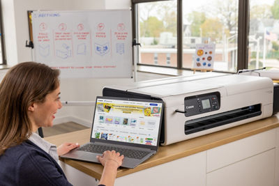 Person Using Laptop to Print