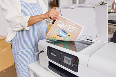 Person Scanning Paper