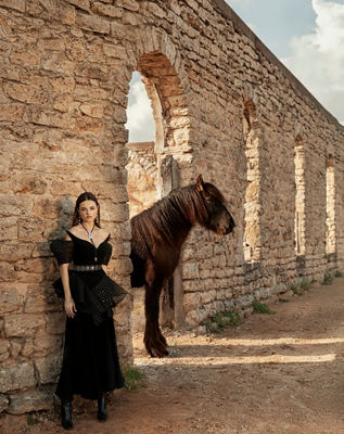 Person Standing Next to a Horse