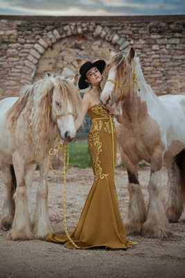 Person Standing In Between Two Horses