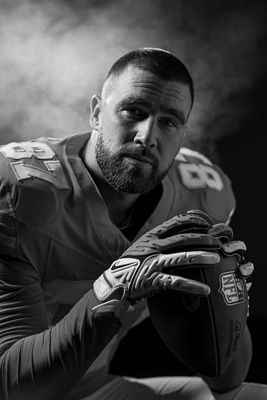 Football Player Posing with Football