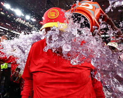 Football Players Dumping Gatorade on the Football Coach