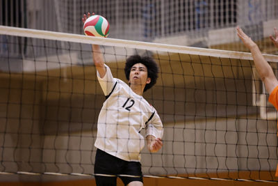 Volleyball Player Spiking a Ball