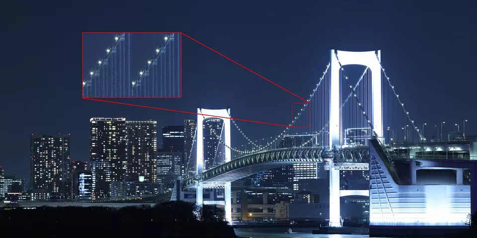 Bridge at Night with a City in the Background