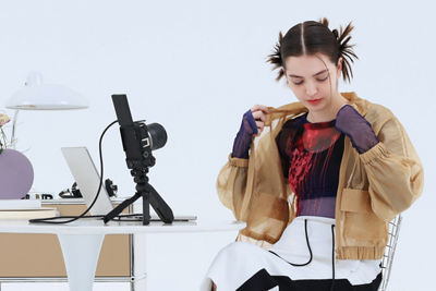 Person Using EOS R50 V to Record Themselves