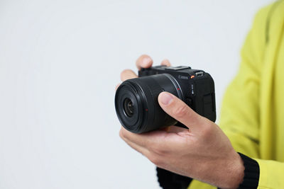 Person Holding EOS R50 V
