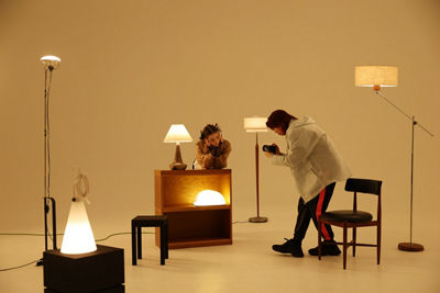 Person Using EOS R50 V to Record a Model