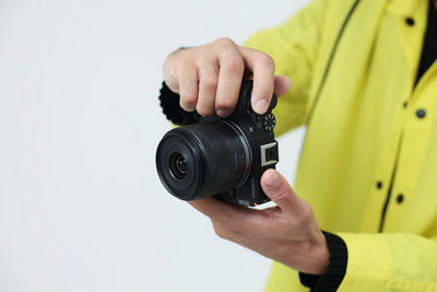 Person Holding EOS R50 V