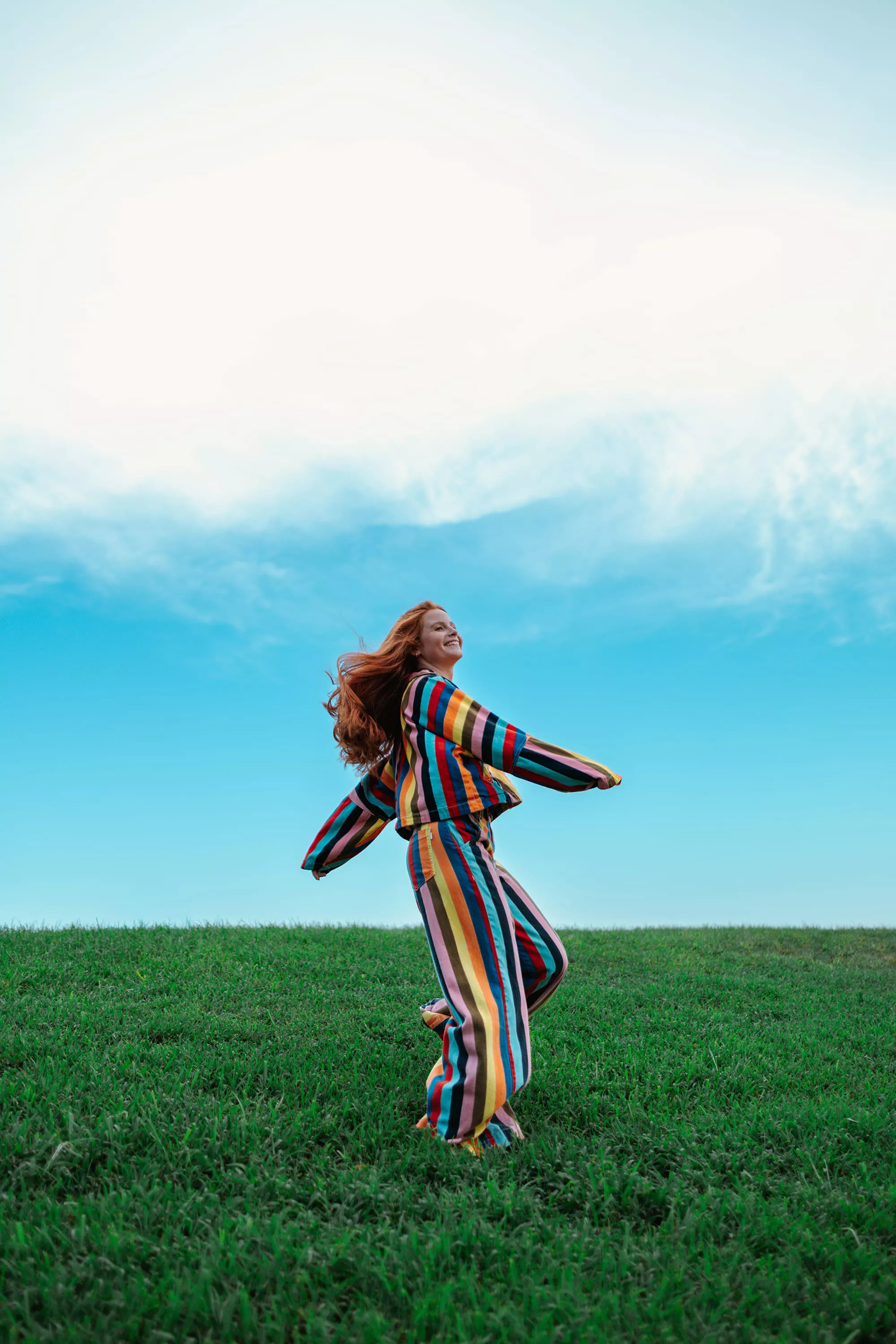 Person in a Grassy Field