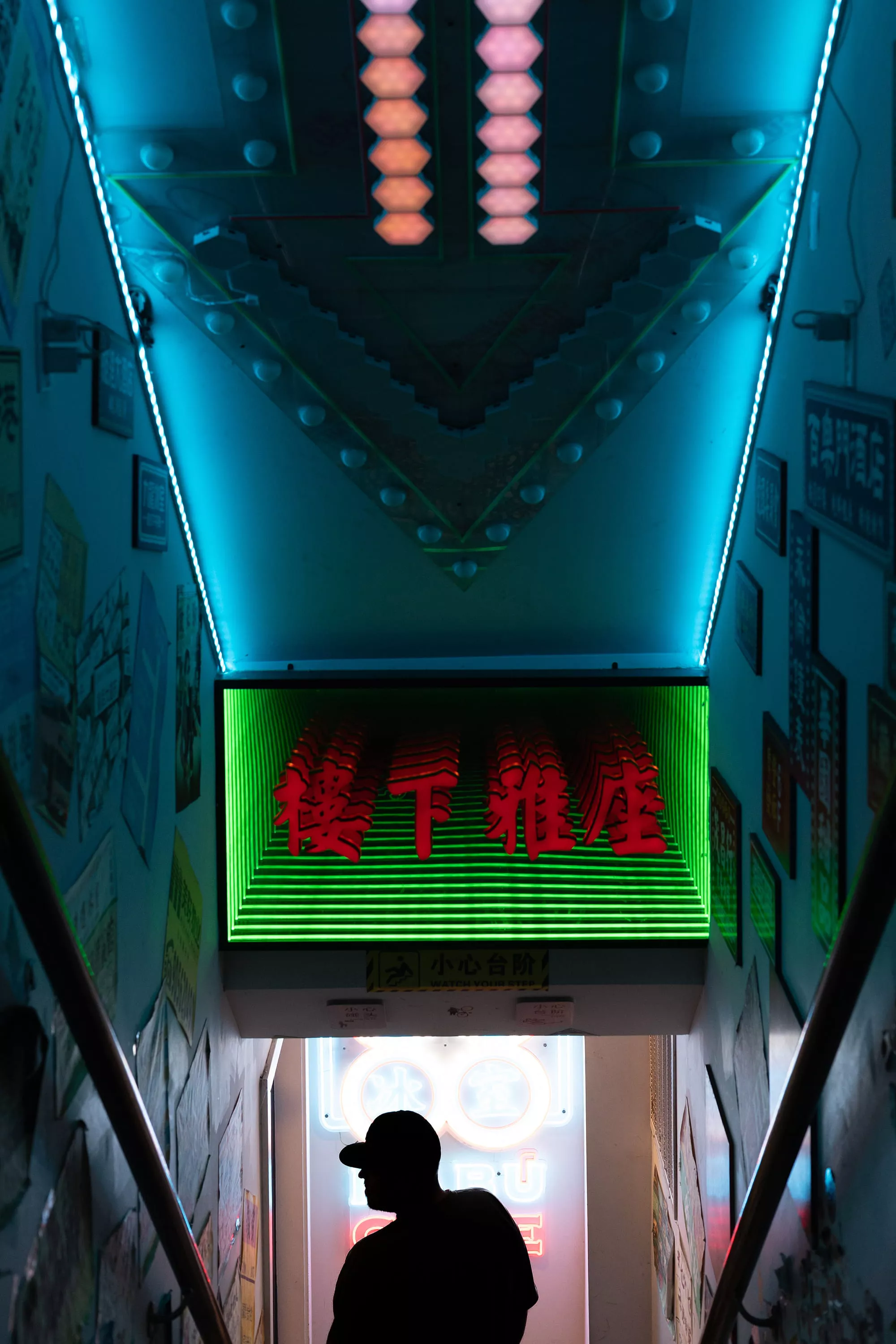 Person Walking Under a Cool Neon Sign in Japanese