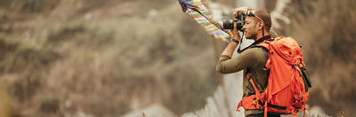 Photographer holding Canon Camera