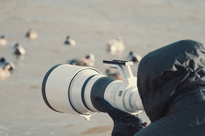 photographer shooting with lens