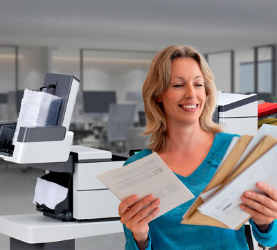 Image of a woman sorting mail