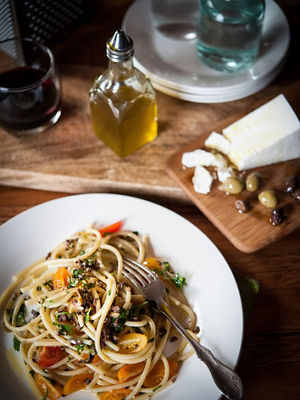white plate of noodles and vegetables