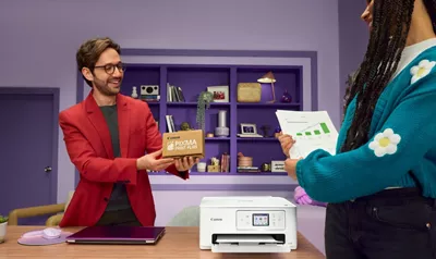 Person Holding Ink from PIXMA Print Plan