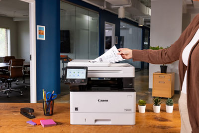 Person Placing Paper to be Scanned