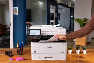 Person Retriving Paper from imageCLASS MF462dw II